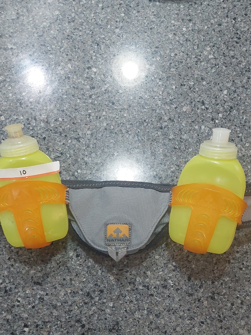 Nathan Hydration Belt with Orange Holders and Yellow Bottles